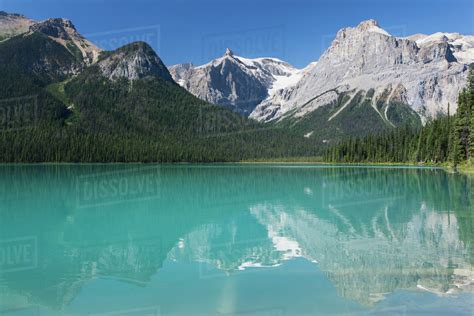 Mountains Reflecting On Mountain Lake With Blue Skyfield British