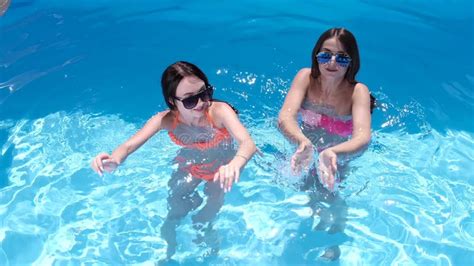 two girls having dancing and having fun in the pool stock video video of people holiday