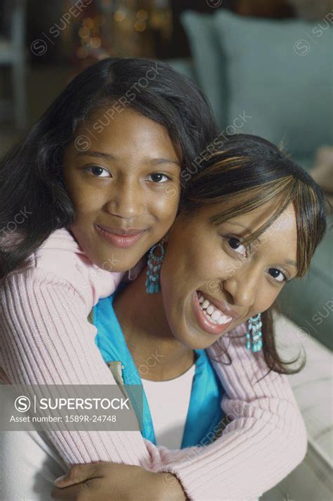 African American Mother And Daughter Hugging Superstock