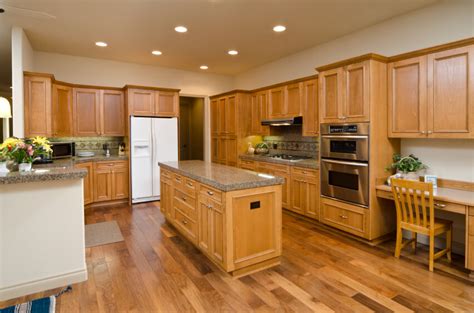 In the picture above is an open type kitchen floor plan, using white cabinets. 52 Enticing Kitchens with Light and Honey Wood Floors ...