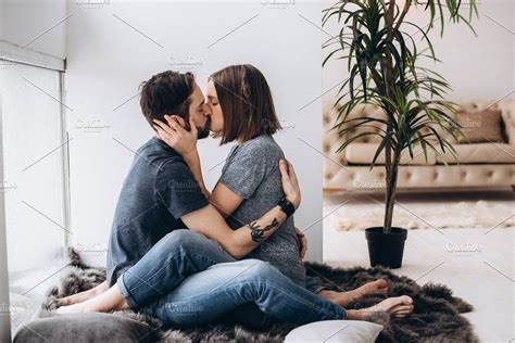 Kissing Couple Sitting On The Floor Couple Sitting Couple Photoshoot Poses Kissing Poses