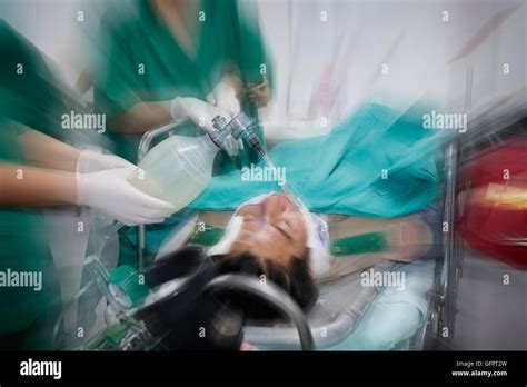 Motion Blurred Photograph Of Doctor And Nurses Treating Critical Male