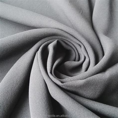Stock Silk Double Georgette Fabric In Light Cream And Black Colour