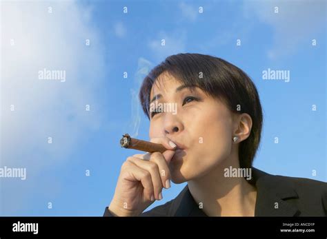 Asian Businesswoman Smoking Cigar Stock Photo Alamy