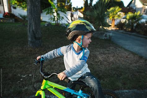 Little Boy Waiting To Go For A Bike Ride By Stocksy Contributor Rob