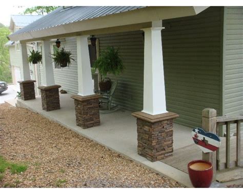A Porch With Two Planters On Each Side