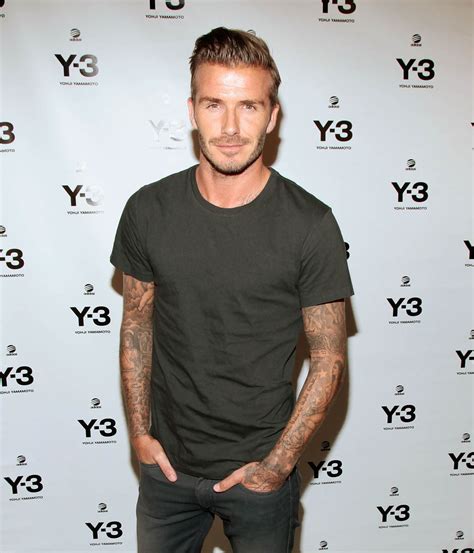 David Beckham Looks Dapper In A Black Dress Shirt With The Sleeves