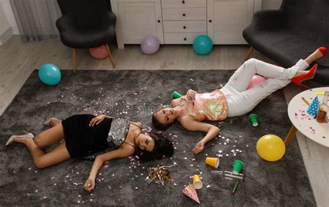 Drunk Friends Sleeping On Floor In Messy Room Stock Image Image Of