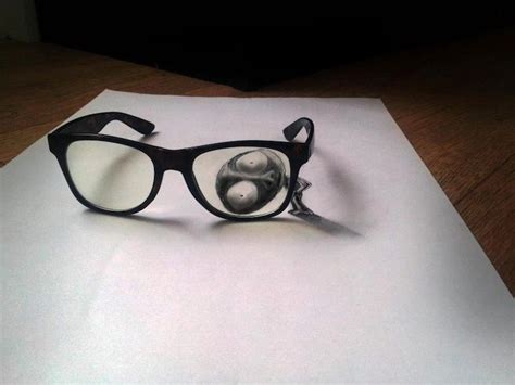 A Pair Of Glasses Sitting On Top Of A Piece Of Paper