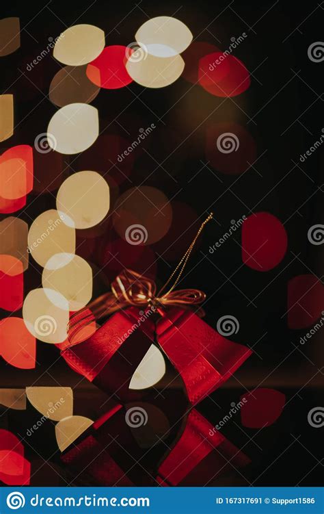 Christmas Bells Against Bokeh Background With Shallow Depth Of Field