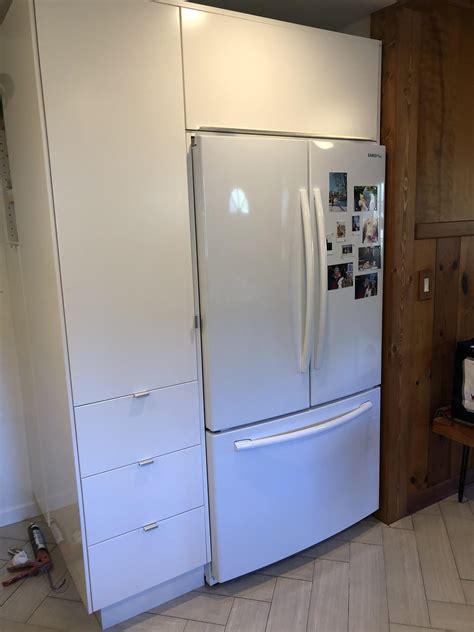 The design and flow of the kitchen wouldn't look right with a void space above the fridge. I built a corner cabinet unit to make my new refrigerator ...