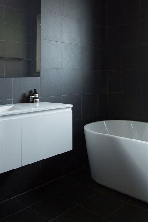 Dark Charcoal Bathroom Tiles With White Vanity Freestanding Bath And