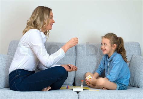 Mother And Daughter Playing Board Game At Home Stock Image Colourbox