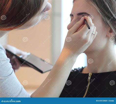 Closeup Of A Makeup Artist Applying Makeup Stock Photo Image Of Gloss