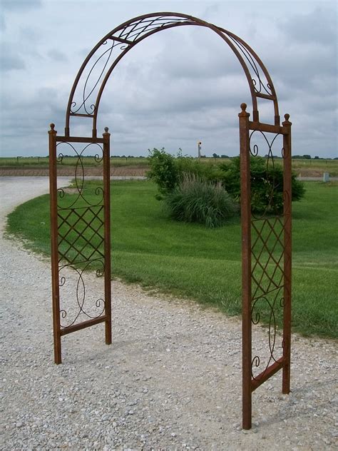 Less expensive trellises made of materials such as wood, plastic, aluminum and mixed metals are also available. Wrought Iron Skyview Arbor & Trellis - Flower Arch