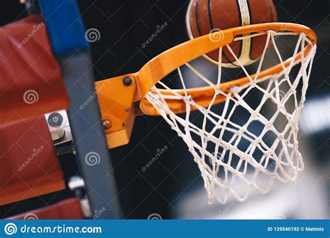 Basketball Scoring Basket At A Sports Arena. Scoring The 