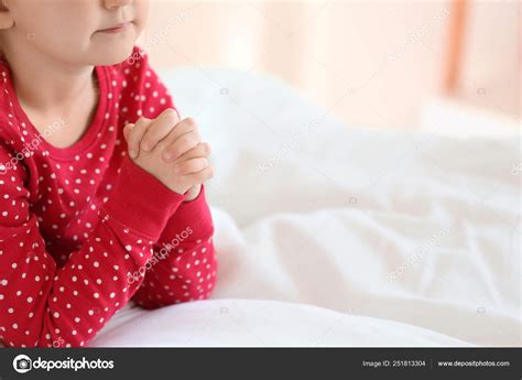 Little Girl Praying In Bedroom Stock Photo By ©serezniy 251813304