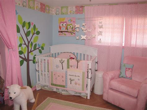 A bedroom suited for a princess, featuring a chic canopy bed. Girls Shared Owl Nursery - Project Nursery