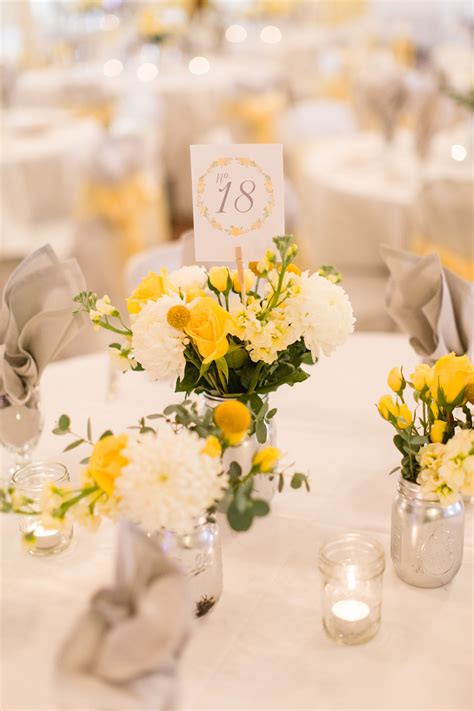 yellow and white centerpiece with mums and craspedia yellow wedding flowers white wedding