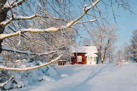 Red Swedish Cottage In Snowy Landscape By Stocksy Contributor