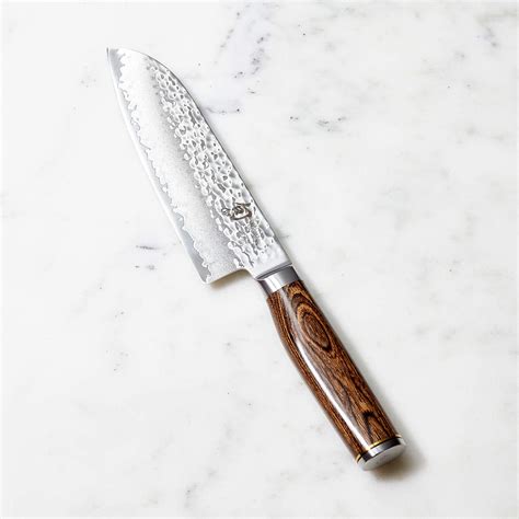 While each knife still takes at least 100 handcrafted steps to. Shun Premier 7" Santoku Knife + Reviews | Crate and Barrel ...