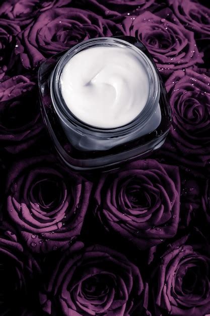 Premium Photo Face Cream Skin Moisturizer On Purple Roses Flowers