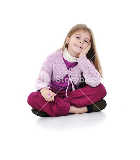 Portrait Of A Cute Little Girl Sitting On Floor Royalty Free Stock