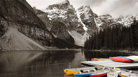Moraine Lake And Boats With Snow Capped Mountain Banff