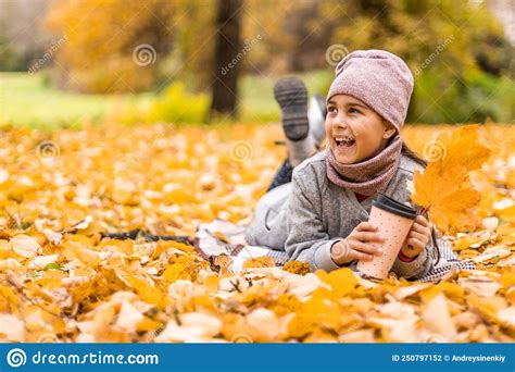 Kids Play In Autumn Park Children Throwing Yellow Leaves Child Girl