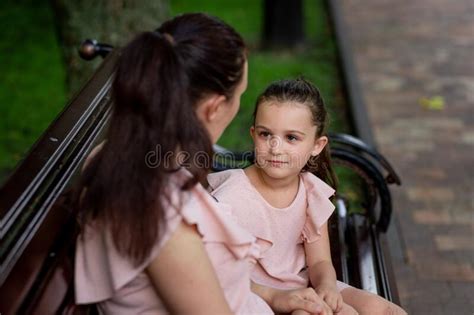 Mother And Daughter 5 6 Years Old Walking In The Park In The Summer Mother Talking To Her