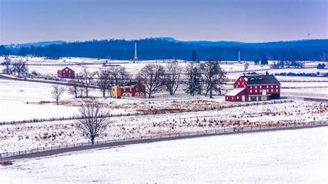 View Of Red Barns And Snow Covered Farm Fields From Longstreet T Stock