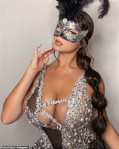 Demi Rose Puts On A VERY Busty Display In A Plunging Mini Dress At Halloween Masquerade Ball