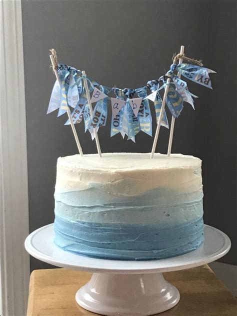 First birthday cakes for boys. Simple boy baby shower cake with blue ombré and double ...