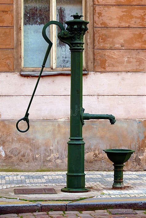 Cast iron pitcher pump yard art. Old Fashioned Iron Water Pump Stock Photo - Image: 5382120