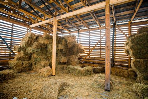 Premium Photo Dry Hay Stacks In Rural Wooden Barn Interior