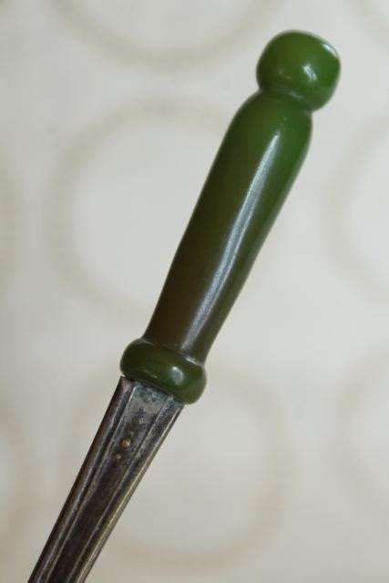 Example 3 patty was born with a silver spoon in her mouth but she ended up a bank robber. old long handled silver spoon w/ spinach green bakelite ...