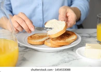 Woman Spreading Butter Onto Slice Bread Stock Photo Shutterstock