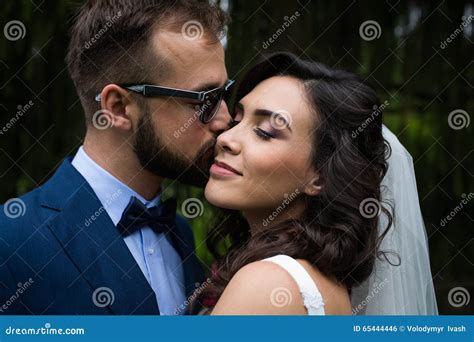 Romantic Sensual Handsome Groom Kissing Beautiful Bride On The Stock