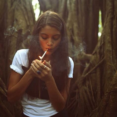Young Beautiful Caucasian Lady Smoking Cigarette On Street