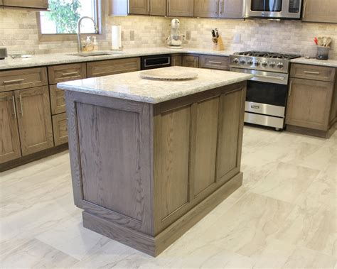 All of the electrical outlets, switches and lights are under the cabinets leaving the uninterrupted backslash. Quad Cities, IL Oak Kitchen In Heather Gray Stain.with ...