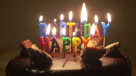 Happy Birthday Candles On Birthday Cake With Melting Wax Stock Footage