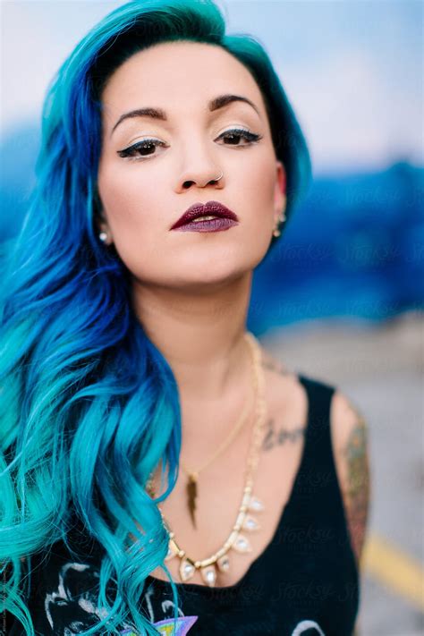 Vertical Portrait Of A Beautiful Hispanic Woman With Blue Dyed Hair By