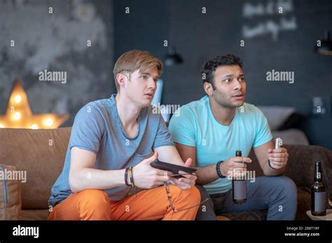 Two Friends Watching Tv Beer High Resolution Stock Photography And