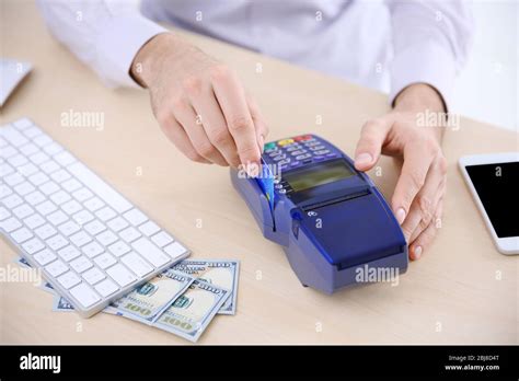 Businessman Using Payment Terminal Stock Photo Alamy
