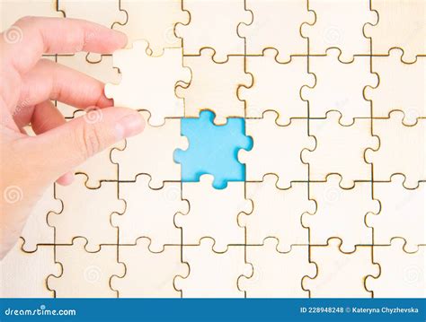 Placing The Final Piece Of A Jigsaw Puzzle Stock Photo Image Of Group