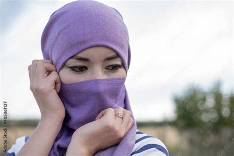 The Muslim Woman In The Headscarf Looked Down Modestly A Married