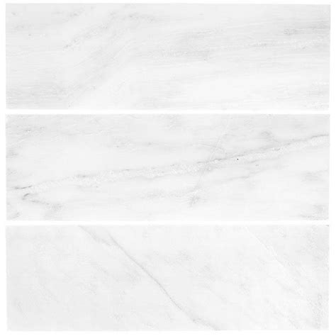 Our carrara tile collection is a classic white stone with a mixed fleuri & vein cut that blend to create subtle yet distinctive patterns. Jeffrey Court Carrara 4 in. x 12 in. Honed Marble Wall ...