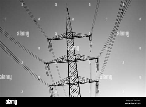 Crossing Electric Pylon In Sunset Sky Stock Photo Alamy