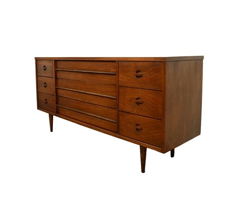 Meticulously handcrafted with beautiful mother of pearl inlays on native wood solids, this modern dresser features an elegantly formed floral pattern. Walnut Long Dresser Bassett Credenza Mid Century Modern by ...