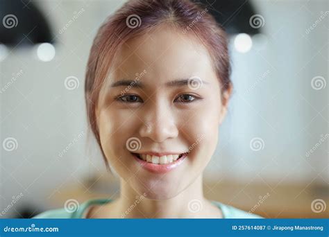 Portrait Of A Young Asian Woman Showing A Happiness Smiling Face Stock